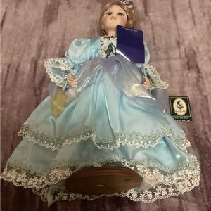 Charming Blue Porcelain Doll with Lace Details
